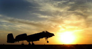 A U.S. A10 takes off in front of the setting sun in Kuwait March 15, 2003. Both U.S. and the British Royal Air Force are continuing to patrol the no fly zone in southern Iraq. POOL REUTERS/Russell Boyce